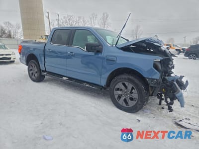 Czwarte zdjęcie samochodu z boku: 2023 FORD F150 LIGHTNING PRO VIN:1FT6W1EV5PWG48184 - miniatura