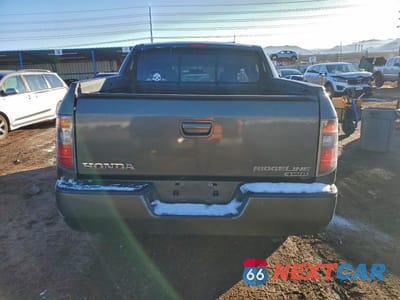 Zdjęcie 6 z 12 samochodu: 2006 HONDA RIDGELINE RTS VIN:2HJYK16486H502008 - miniatura