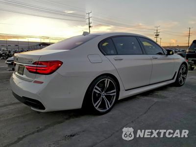 Trzecie zdjęcie samochodu z tyłu: 2016 BMW 740 I VIN:WBA7E2C57GG738685 - miniatura