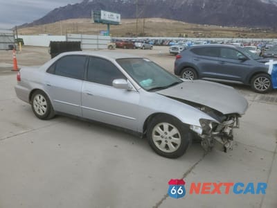 Czwarte zdjęcie samochodu z boku: 1999 HONDA ACCORD LX VIN:1HGCG5543XA140440 - miniatura