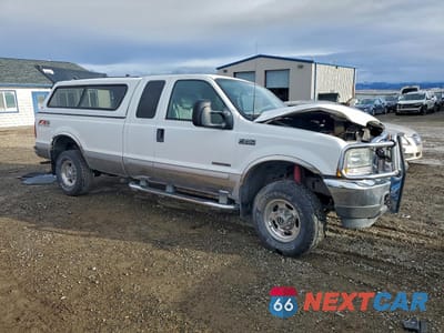 Czwarte zdjęcie samochodu z boku: 2003 FORD F250 SUPER DUTY VIN:1FTNX21F03EA62098 - miniatura