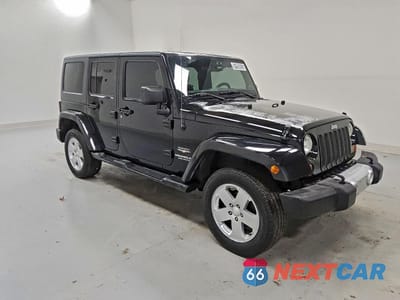 Czwarte zdjęcie samochodu z boku: 2012 JEEP WRANGLER UNLIMITED SAHARA VIN:1C4HJWEG7CL113939 - miniatura