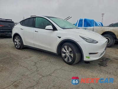 Czwarte zdjęcie samochodu z boku: 2022 TESLA MODEL Y VIN:7SAYGDEE2NF449802 - miniatura