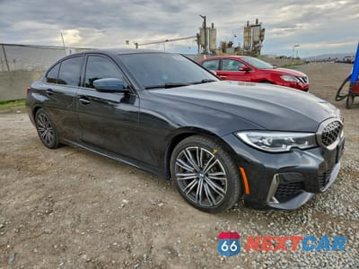 Czwarte zdjęcie samochodu z boku: 2021 BMW M340I VIN:3MW5U7J02M8B56504 - miniatura