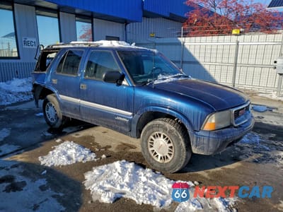 Czwarte zdjęcie samochodu z boku: 1999 GMC JIMMY VIN:1GKDT13WXX2558102 - miniatura