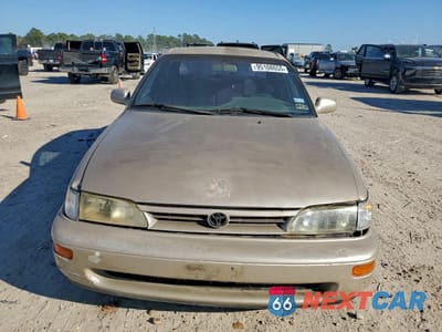 Piąte zdjęcie samochodu w środku: 1995 TOYOTA COROLLA LE VIN:1NXAE09B0SZ305337 - miniatura