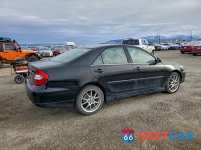 Trzecie zdjęcie samochodu z tyłu: 2003 TOYOTA CAMRY XLE V6 VIN:JTDBF30K830094269 - miniatura