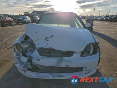 Piąte zdjęcie samochodu w środku: 1996 HONDA CIVIC DX VIN:2HGEJ6345TH111035 - miniatura