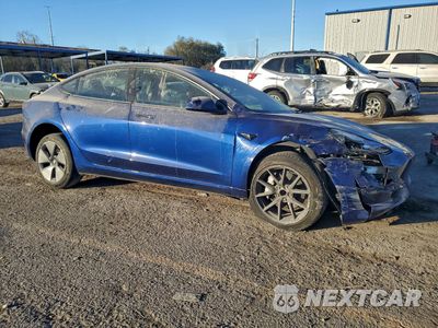 Czwarte zdjęcie samochodu z boku: 2023 TESLA MODEL 3 VIN:5YJ3E1EAXPF432726 - miniatura