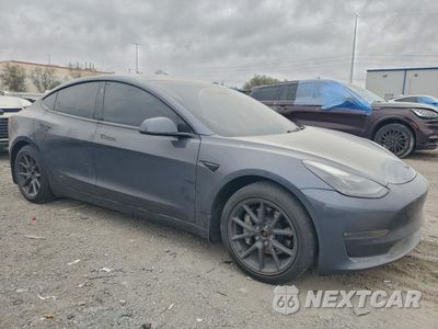 Czwarte zdjęcie samochodu z boku: 2022 TESLA MODEL 3 VIN:5YJ3E1EB2NF198118 - miniatura