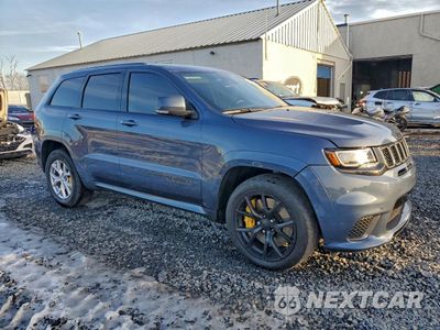Czwarte zdjęcie samochodu z boku: 2020 JEEP GRAND CHEROKEE TRACKHAWK VIN:1C4RJFN94LC407403 - miniatura