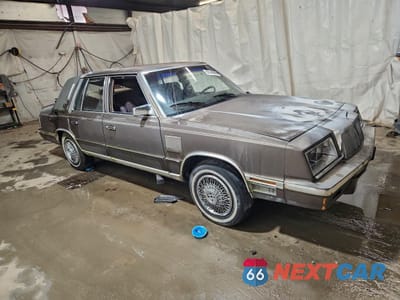 Czwarte zdjęcie samochodu z boku: 1984 CHRYSLER NEW YORKER VIN:1C3BT56GXEC155750 - miniatura