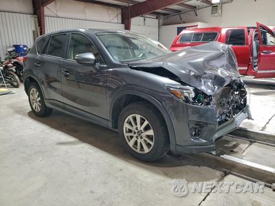 Czwarte zdjęcie samochodu z boku: 2016 MAZDA CX-5 TOURING VIN:JM3KE4CYXG0600061 - miniatura