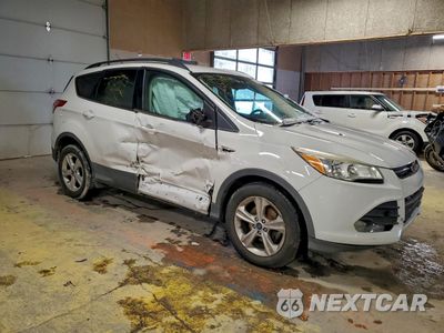 Czwarte zdjęcie samochodu z boku: 2014 FORD ESCAPE SE VIN:1FMCU0GX1EUD42783 - miniatura