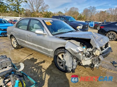 Czwarte zdjęcie samochodu z boku: 2005 KIA OPTIMA LX V6 VIN:KNAGD128355414537 - miniatura