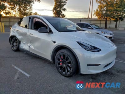 Czwarte zdjęcie samochodu z boku: 2023 TESLA MODEL Y VIN:7SAYGDEE0PA052489 - miniatura