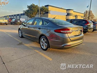 Trzecie zdjęcie samochodu z tyłu: 2018 FORD FUSION S HYBRID VIN:3FA6P0UU9JR279071 - miniatura