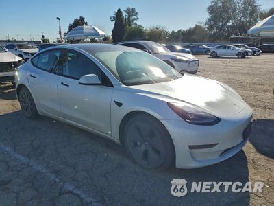 Czwarte zdjęcie samochodu z boku: 2021 TESLA MODEL 3 VIN:5YJ3E1EB1MF961065 - miniatura