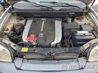 Zdjęcie 12 z 15 samochodu: 2004 HYUNDAI SANTA FE GLS VIN:KM8SC73E34U641153 - miniatura