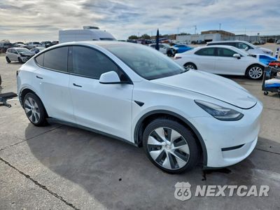 Czwarte zdjęcie samochodu z boku: 2022 TESLA MODEL Y VIN:7SAYGAEEXNF323878 - miniatura