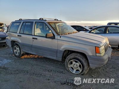 Czwarte zdjęcie samochodu z boku: 1997 JEEP GRAND CHEROKEE LAREDO VIN:1J4GZ58S9VC709050 - miniatura