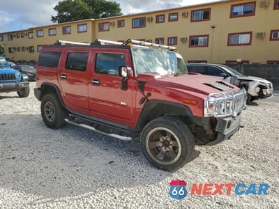 Czwarte zdjęcie samochodu z boku: 2005 HUMMER H2 VIN:5GRGN23U95H122700 - miniatura