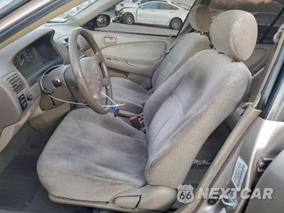 Zdjęcie 7 z 14 samochodu: 2001 TOYOTA COROLLA CE VIN:1NXBR12E51Z477624 - miniatura
