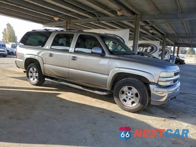 Czwarte zdjęcie samochodu z boku: 2003 CHEVROLET SUBURBAN K1500 VIN:3GNFK16T73G176904 - miniatura