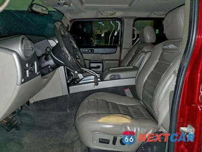 Zdjęcie 7 z 14 samochodu: 2003 HUMMER H2 VIN:5GRGN23U23H144695 - miniatura