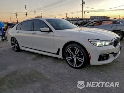 Czwarte zdjęcie samochodu z boku: 2016 BMW 740 I VIN:WBA7E2C57GG738685 - miniatura