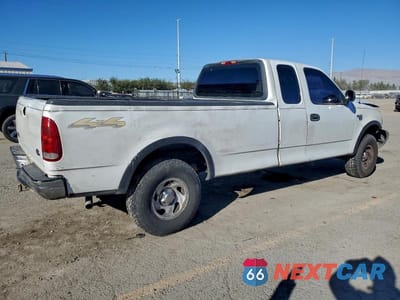 Trzecie zdjęcie samochodu z tyłu: 2000 FORD F150 VIN:1FTRX18W4YNB17399 - miniatura