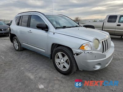 Czwarte zdjęcie samochodu z boku: 2010 JEEP COMPASS VIN:1J4NT4FB6AD554211 - miniatura