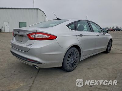 Trzecie zdjęcie samochodu z tyłu: 2016 FORD FUSION SE HYBRID VIN:3FA6P0LU1GR291323 - miniatura