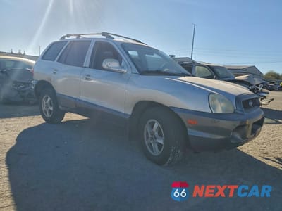 Czwarte zdjęcie samochodu z boku: 2002 HYUNDAI SANTA FE GLS VIN:KM8SC13D22U143687 - miniatura
