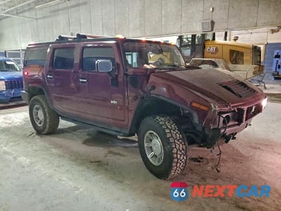 Czwarte zdjęcie samochodu z boku: 2003 HUMMER H2 VIN:5GRGN23U23H144695 - miniatura