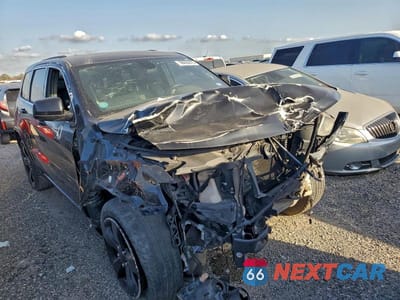 Czwarte zdjęcie samochodu z boku: 2014 JEEP GRAND CHEROKEE LAREDO VIN:1C4RJEAG8EC507005 - miniatura