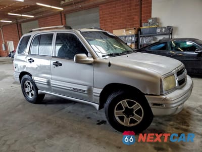 Czwarte zdjęcie samochodu z boku: 2002 CHEVROLET TRACKER LT VIN:2CNBE634226900464 - miniatura