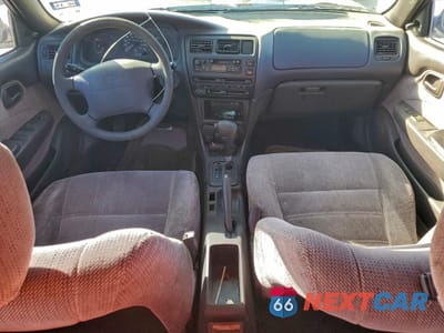 Zdjęcie 8 z 12 samochodu: 1995 TOYOTA COROLLA LE VIN:1NXAE09B0SZ305337 - miniatura