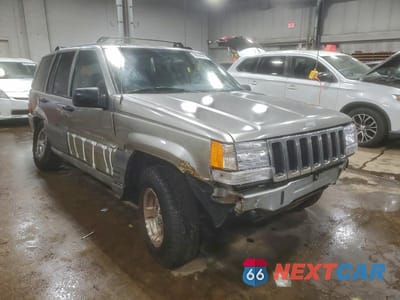 Czwarte zdjęcie samochodu z boku: 1998 JEEP GRAND CHEROKEE LAREDO VIN:1J4GZ58S1WC237685 - miniatura