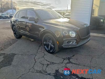 Czwarte zdjęcie samochodu z boku: 2017 BENTLEY BENTAYGA VIN:SJAAC2ZV4HC016056 - miniatura
