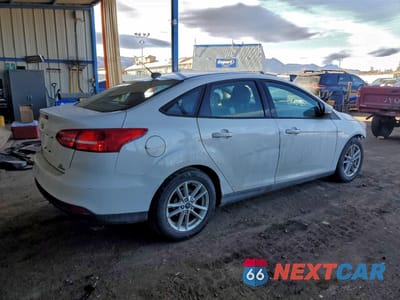 Trzecie zdjęcie samochodu z tyłu: 2016 FORD FOCUS SE VIN:1FADP3F22GL391545 - miniatura