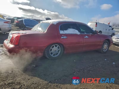 Trzecie zdjęcie samochodu z tyłu: 1999 LINCOLN TOWN CAR SIGNATURE VIN:1LNHM82W4XY701557 - miniatura