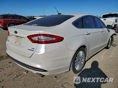 Trzecie zdjęcie samochodu z tyłu: 2016 FORD FUSION SE HYBRID VIN:3FA6P0LU9GR203795 - miniatura