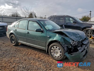 Czwarte zdjęcie samochodu z boku: 2002 VOLKSWAGEN JETTA GLS TDI VIN:3VWSP69M52M137297 - miniatura