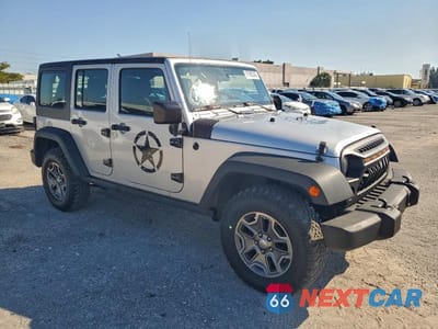 Czwarte zdjęcie samochodu z boku: 2012 JEEP WRANGLER UNLIMITED SPORT VIN:1C4BJWDG8CL246006 - miniatura