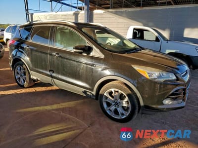 Czwarte zdjęcie samochodu z boku: 2016 FORD ESCAPE TITANIUM VIN:1FMCU9JXXGUA65101 - miniatura