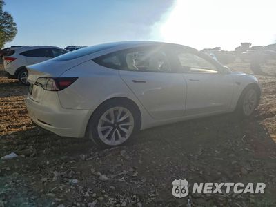 Trzecie zdjęcie samochodu z tyłu: 2023 TESLA MODEL 3 VIN:5YJ3E1EA4PF397309 - miniatura