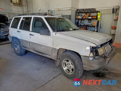 Czwarte zdjęcie samochodu z boku: 1996 JEEP GRAND CHEROKEE LAREDO VIN:1J4GZ58S7TC321098 - miniatura