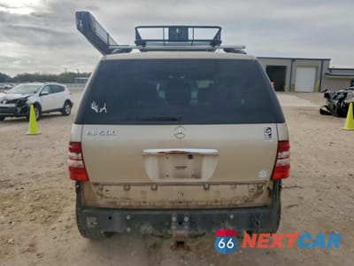 Zdjęcie 6 z 14 samochodu: 2004 MERCEDES-BENZ ML 500 VIN:4JGAB75E44A463198 - miniatura