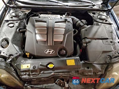 Zdjęcie 11 z 12 samochodu: 2003 HYUNDAI TIBURON GT VIN:KMHHN65F13U029035 - miniatura